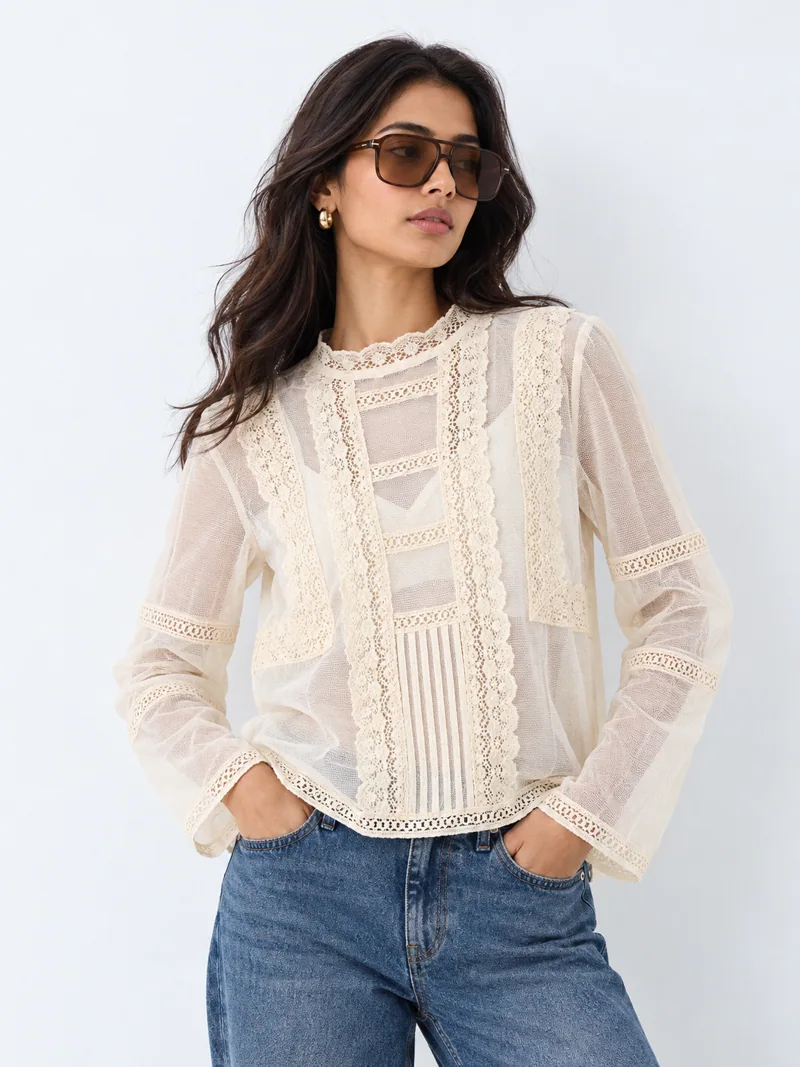 Ivory lace blouse fashion look on Indian-looking model